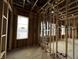 Bedroom shows the stud framing and window framing during a construction phase with unfinished plumbing at 1509 Chatham Rdg Ct, Westfield, IN 46074