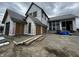Two-story home under construction with stone and siding details and attached two-car garage at 1509 Chatham Rdg Ct, Westfield, IN 46074