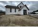 Two-story home under construction with stone and siding details on a cloudy day at 1509 Chatham Rdg Ct, Westfield, IN 46074