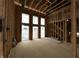 New construction living room with exposed wood beams and open view to the outdoors at 1509 Chatham Rdg Ct, Westfield, IN 46074
