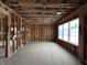 Open-concept living room with wooden framing, large windows, and natural light at 1509 Chatham Rdg Ct, Westfield, IN 46074