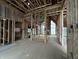 Spacious living room under construction with wood framing, high ceilings, and large windows at 1509 Chatham Rdg Ct, Westfield, IN 46074