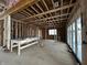 Future living room with exposed wood framing and natural light from the folding doors at 1509 Chatham Rdg Ct, Westfield, IN 46074