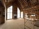 Living room under construction featuring high ceilings, large windows, and a fireplace at 1509 Chatham Rdg Ct, Westfield, IN 46074