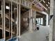 Room under construction with exposed wood framing and the future staircase at 1509 Chatham Rdg Ct, Westfield, IN 46074