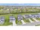 Aerial view showcases well-maintained homes with manicured lawns and tree-lined streets in a desirable neighborhood at 15120 Downham Dr, Fishers, IN 46037