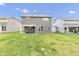 View of the back of a house with a large green lawn and neighboring houses at 15120 Downham Dr, Fishers, IN 46037