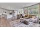 Open-concept living area flows into the kitchen with modern appliances and breakfast bar at 15120 Downham Dr, Fishers, IN 46037