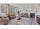 Inviting living room with stylish decor, fireplace, and plenty of natural light at 15120 Downham Dr, Fishers, IN 46037