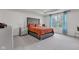 Bright main bedroom features a tufted headboard, carpet, and a window at 15120 Downham Dr, Fishers, IN 46037