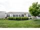 A manicured backyard with a patio and green lawn at 16204 Oakford Trl, Fishers, IN 46037
