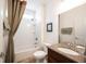 Bathroom featuring a shower-tub, granite vanity, and neutral-toned tile floors, designed for everyday comfort at 16204 Oakford Trl, Fishers, IN 46037