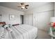 Comfortable bedroom with ample natural light from large windows, ceiling fan, neutral walls, and stylish decor at 16204 Oakford Trl, Fishers, IN 46037
