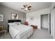 Comfortable bedroom with ample natural light from large windows, ceiling fan, neutral walls, and stylish decor at 16204 Oakford Trl, Fishers, IN 46037
