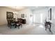 Elegant dining area with carpet, chandelier, and furniture at 16204 Oakford Trl, Fishers, IN 46037