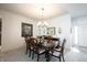 Cozy dining room with wood table, chandelier, and white walls at 16204 Oakford Trl, Fishers, IN 46037