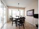 Cozy dining room with a bay window, modern table, and stylish decor, perfect for intimate meals and gatherings at 16204 Oakford Trl, Fishers, IN 46037