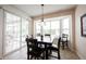 Traditional dining room featuring a dark wood table and chairs and bright bay window at 16204 Oakford Trl, Fishers, IN 46037