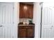 Hallway nook featuring a built-in cabinet with granite countertop and decorative accents at 16204 Oakford Trl, Fishers, IN 46037