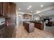 Beautiful kitchen with a center island, granite countertops, and ample cabinet space, open to the living area at 16204 Oakford Trl, Fishers, IN 46037