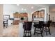 Gourmet kitchen with stainless steel appliances, granite countertops, and a breakfast bar, open to the dining area at 16204 Oakford Trl, Fishers, IN 46037