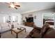 Inviting living room with cozy seating, decorative accents, and an open layout leading to the entryway and bedroom at 16204 Oakford Trl, Fishers, IN 46037