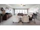 Bright living room with carpet, furniture, ceiling fan, and windows at 16204 Oakford Trl, Fishers, IN 46037