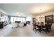 Open living and dining area featuring neutral carpet, dining table and chandelier at 16204 Oakford Trl, Fishers, IN 46037