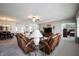 Bright and airy living room with comfortable seating and an open floor plan connecting to the dining and bedroom areas at 16204 Oakford Trl, Fishers, IN 46037