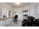 Spacious office space with a built-in desk and cabinetry, neutral decor, and natural light at 16204 Oakford Trl, Fishers, IN 46037
