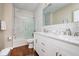 Bathroom features marble tile in the shower and a double sink vanity with modern fixtures at 1641 N Cornell Ave, Indianapolis, IN 46202