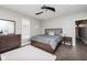 This bedroom boasts a ceiling fan, wood floors, and an area rug at 1641 N Cornell Ave, Indianapolis, IN 46202