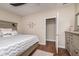 Bright bedroom features stylish décor, a comfortable bed, and ample natural light from the nearby window at 1641 N Cornell Ave, Indianapolis, IN 46202