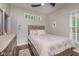 Cozy bedroom with hardwood floors, neutral decor, and a comfortable double bed at 1641 N Cornell Ave, Indianapolis, IN 46202