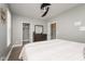 This bedroom showcases a large bed, stylish wooden dresser, and a view into a walk-in closet at 1641 N Cornell Ave, Indianapolis, IN 46202