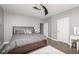 This bedroom features a plush area rug, ceiling fan, and vanity offering a cozy and stylish retreat at 1641 N Cornell Ave, Indianapolis, IN 46202