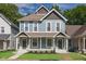 Charming duplex home boasts a well-maintained lawn, a quaint porch, and an inviting facade at 1641 N Cornell Ave, Indianapolis, IN 46202