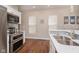 Modern kitchen design with stainless steel appliances and white cabinetry offering a clean aesthetic at 1641 N Cornell Ave, Indianapolis, IN 46202