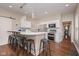 Bright kitchen with stainless appliances, breakfast bar, and modern pendant lighting and seating at 1641 N Cornell Ave, Indianapolis, IN 46202
