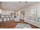 Open living room showcases hardwood floors, neutral decor, and flows into the modern kitchen at 1641 N Cornell Ave, Indianapolis, IN 46202