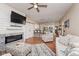 Spacious living room features fireplace, open layout to kitchen, and hardwood floors at 1641 N Cornell Ave, Indianapolis, IN 46202