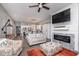 Open-concept living room features a modern fireplace, comfortable seating, and seamless flow to the kitchen at 1641 N Cornell Ave, Indianapolis, IN 46202