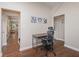 Home office area with natural lighting, a work desk, and views of the entryway and living area at 1641 N Cornell Ave, Indianapolis, IN 46202