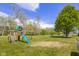Enjoy outdoor fun with a backyard play-set, swing, and vast green space at 1840 W 100 N, Columbus, IN 47201