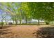 Expansive backyard with mature trees and a storage shed at 1840 W 100 N, Columbus, IN 47201