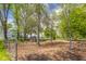 Fenced backyard featuring mature trees and an outdoor shed at 1840 W 100 N, Columbus, IN 47201