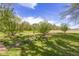 Lush backyard featuring meticulously maintained lawn, mature trees, and thoughtful landscaping at 1840 W 100 N, Columbus, IN 47201