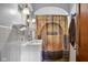 A stylish bathroom featuring a modern sink, arched decor, and whimsical Platform 9 3/4 shower curtain at 1840 W 100 N, Columbus, IN 47201
