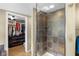 Bathroom features a walk-in shower with dark tile and a large walk-in closet at 1840 W 100 N, Columbus, IN 47201