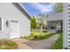 Home exterior with detached garage and screened-in porch at 1840 W 100 N, Columbus, IN 47201
